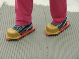 Spiked shoes Kusky in use